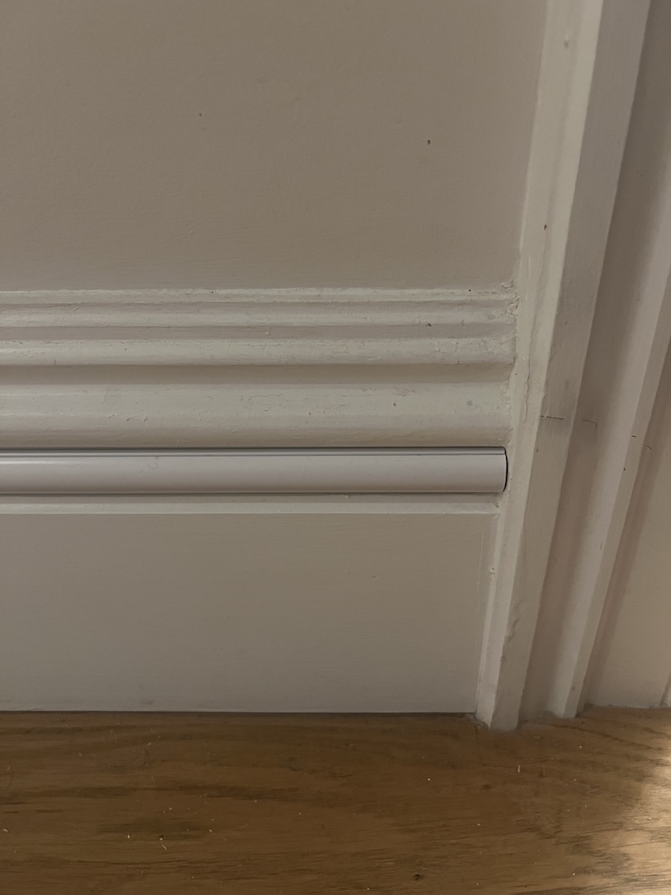 Cable trunking hiding the hole in my skirting board